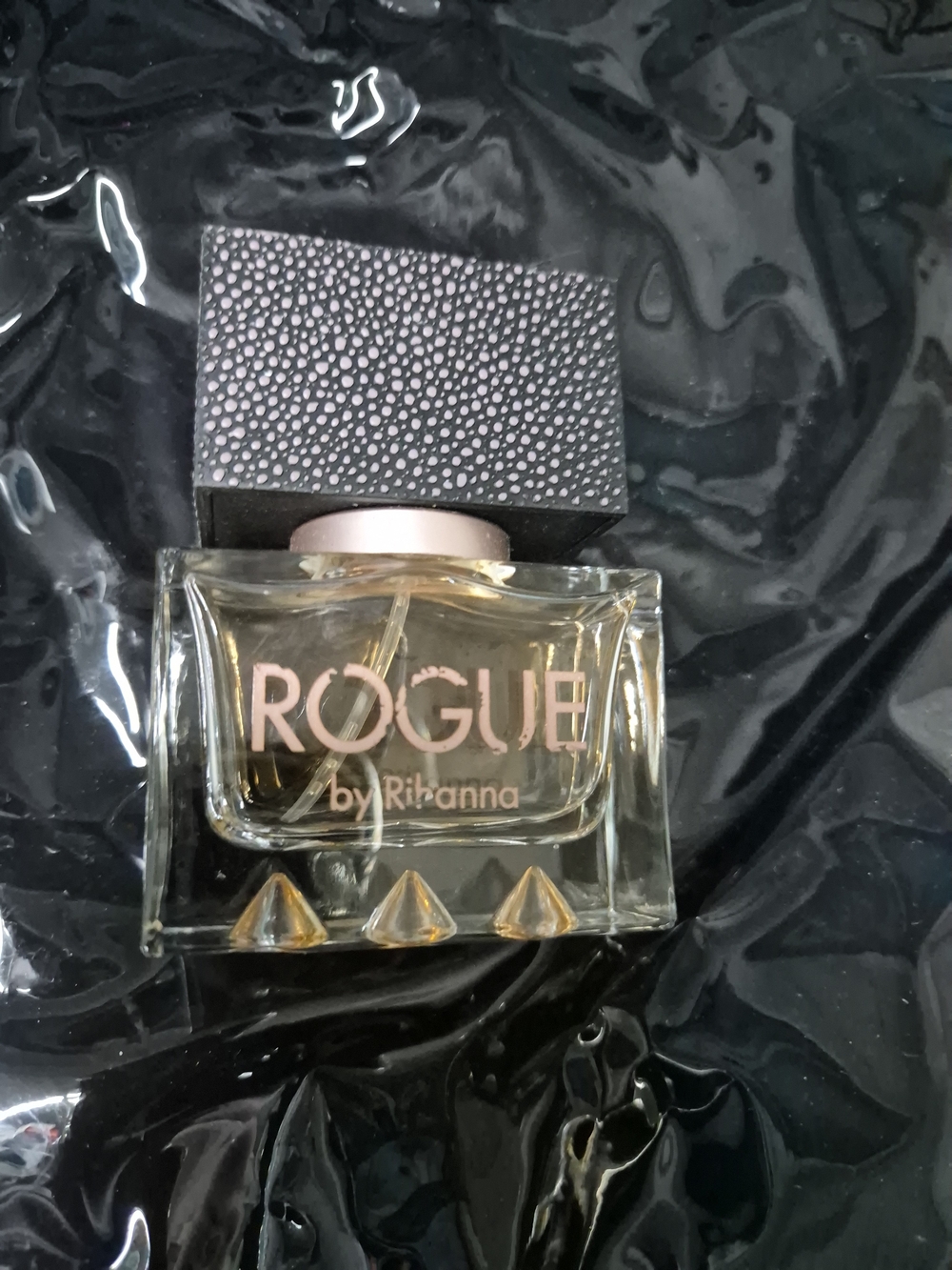 Rihanna Rogue Perfume Bottle with Pink and Black Accents